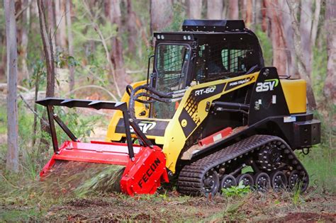 t550 skid steer running a ground mulcher|forestry mulcher for skid steer.